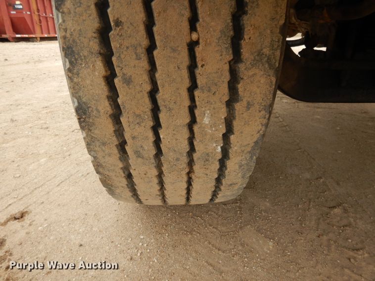 image for item DI8010 1999 Sterling Acterra  roll-off container truck