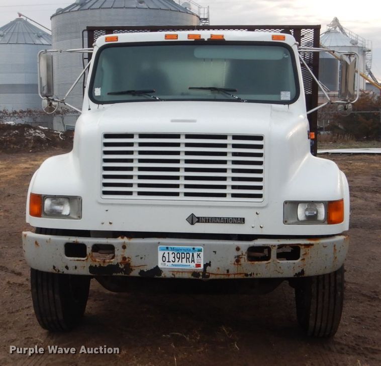 image for item HU9813 2000 International 4700  dump flatbed truck