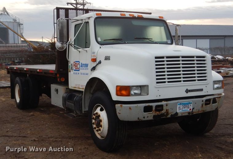 image for item HU9813 2000 International 4700  dump flatbed truck