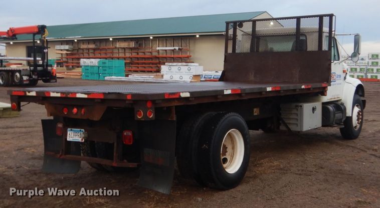 image for item HU9813 2000 International 4700  dump flatbed truck
