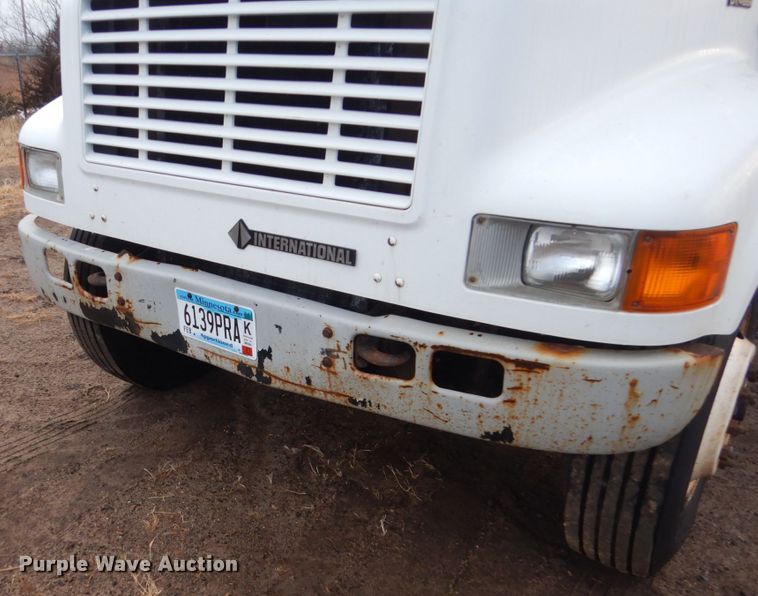 image for item HU9813 2000 International 4700  dump flatbed truck