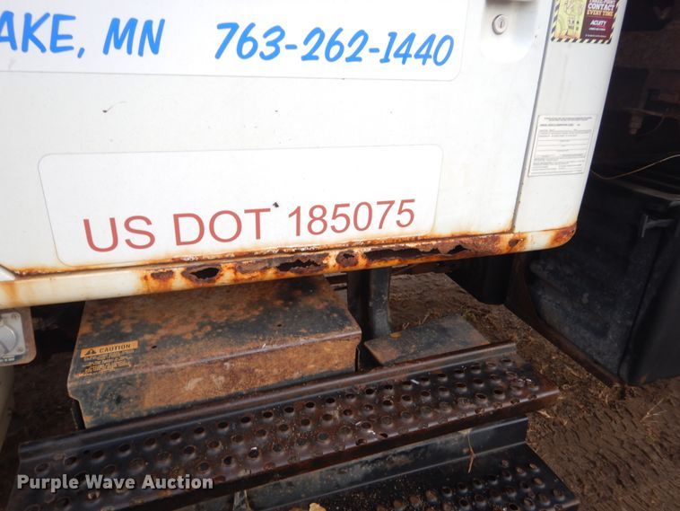 image for item HU9813 2000 International 4700  dump flatbed truck