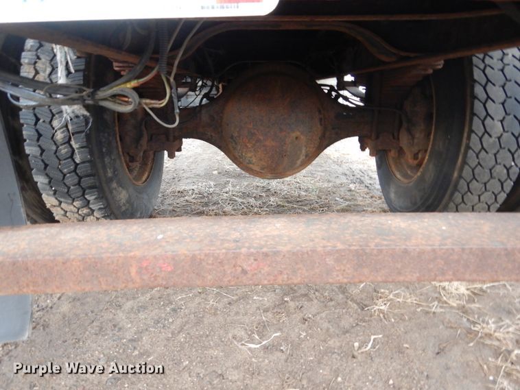 image for item HU9813 2000 International 4700  dump flatbed truck