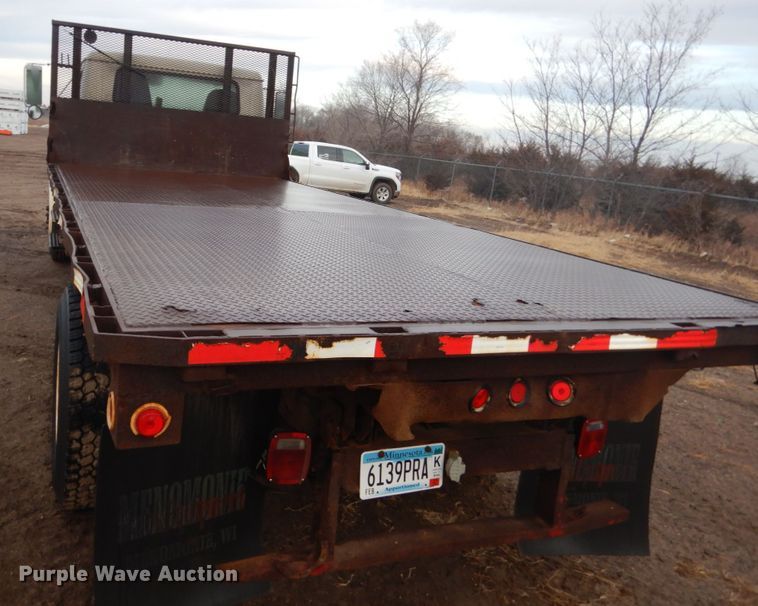 image for item HU9813 2000 International 4700  dump flatbed truck