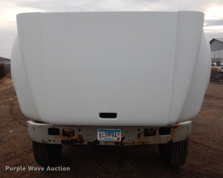 image for item HU9813 2000 International 4700  dump flatbed truck