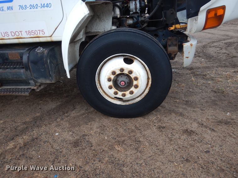 image for item HU9813 2000 International 4700  dump flatbed truck