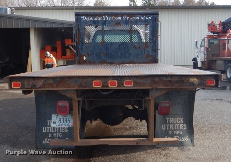 image for item HU9815 2002 GMC C7500  dump flatbed truck