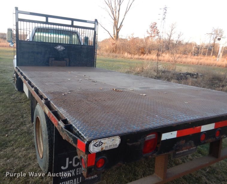 image for item HU9819 2002 Chevrolet C6500  dump flatbed truck