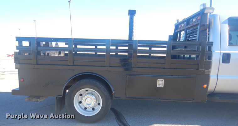 image for item AE9502 2014 Ford F550 Super Duty XLT  Crew Cab flatbed truck