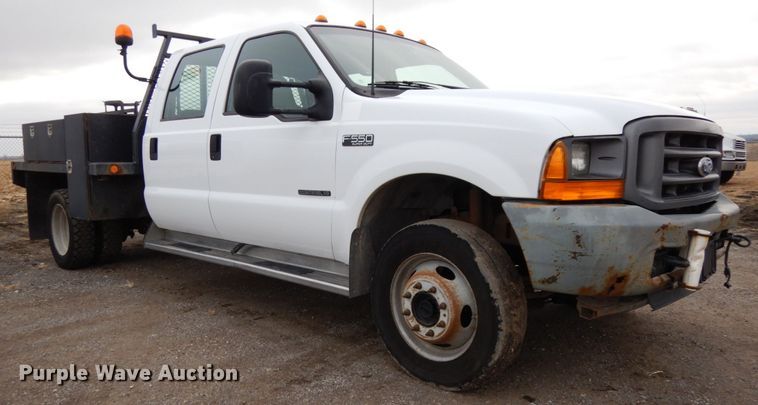 image for item DJ5777 2001 Ford F550 Super Duty XL  Crew Cab flatbed pickup truck