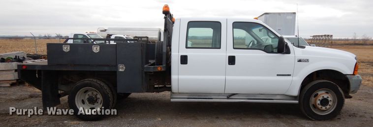 image for item DJ5777 2001 Ford F550 Super Duty XL  Crew Cab flatbed pickup truck