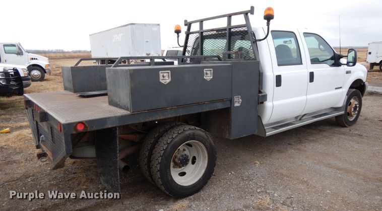 image for item DJ5777 2001 Ford F550 Super Duty XL  Crew Cab flatbed pickup truck