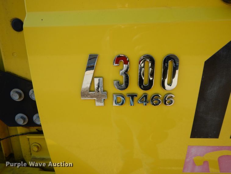 image for item HP9105 2004 International 4300  flatbed truck with conveyor