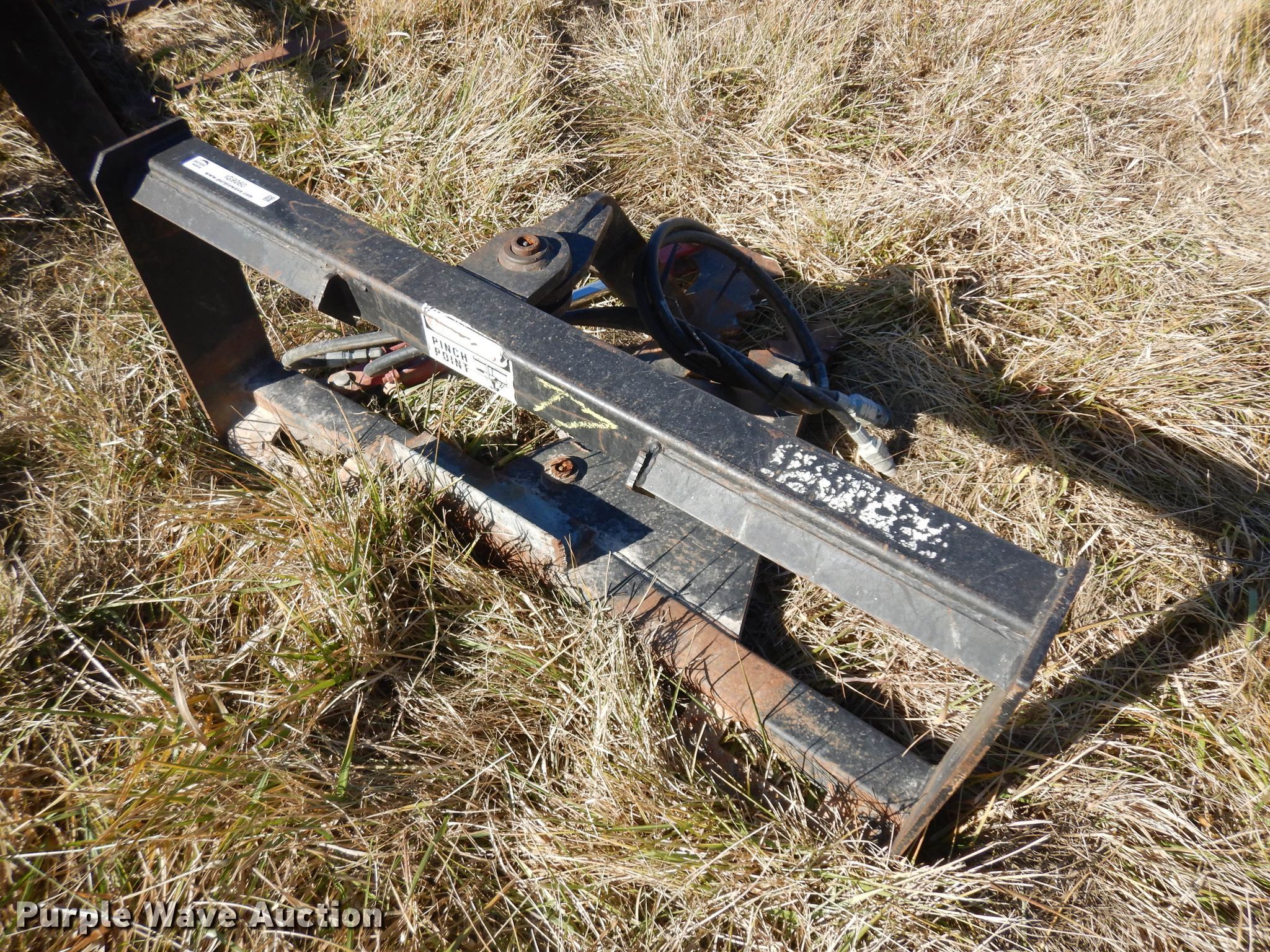 Skid steer tree puller in Osawatomie, KS Item IG9060 sold Purple Wave