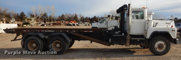 image for item DL2637 1995 Mack DM600  roll-off container truck