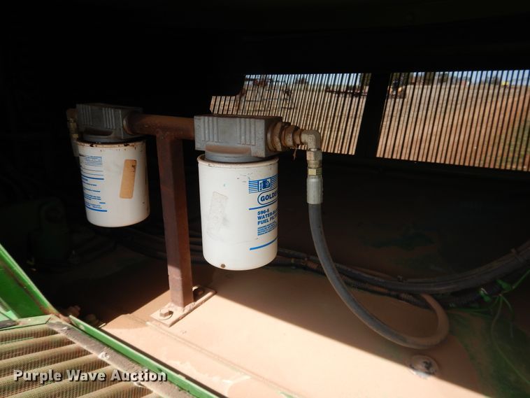 image for item DJ8273 1996 John Deere 7450  cotton stripper