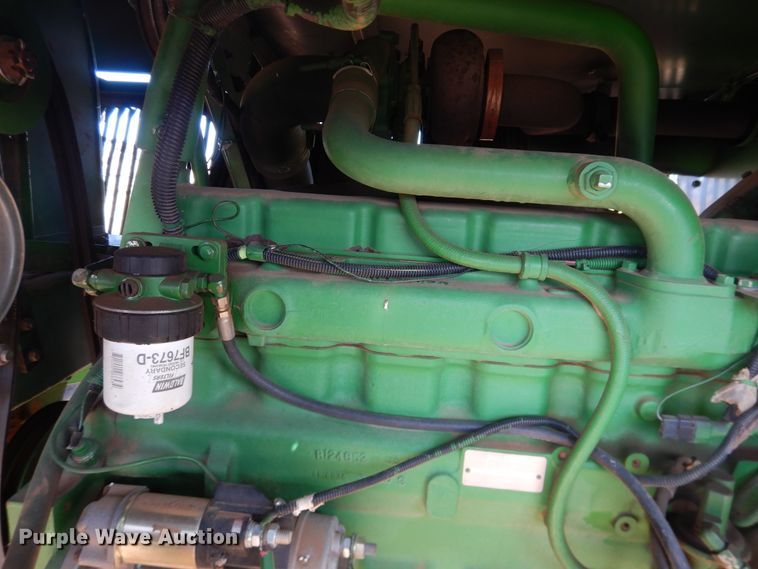 image for item DJ8273 1996 John Deere 7450  cotton stripper