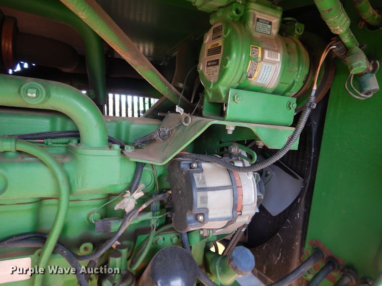 image for item DJ8273 1996 John Deere 7450  cotton stripper