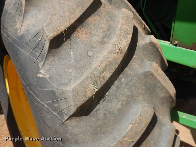 image for item DJ8273 1996 John Deere 7450  cotton stripper