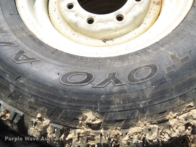 image for item DL0889 (4) Goodyear 265/75R16 tires and skid steer wheels
