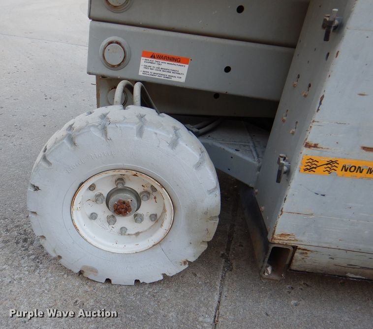 image for item DL2208 1999 Mec 2548HT  scissor lift