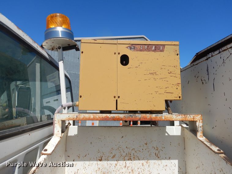 image for item DJ1209 1992 Ford F700  pot hole patcher truck