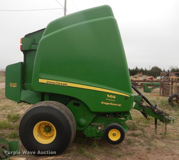 image for item IJ9308 2013 John Deere 569 Premium  round baler