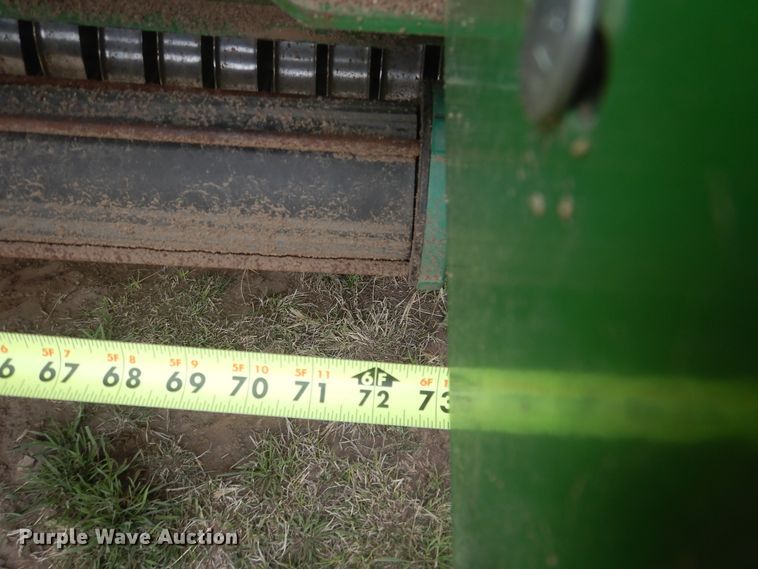 image for item IJ9308 2013 John Deere 569 Premium  round baler