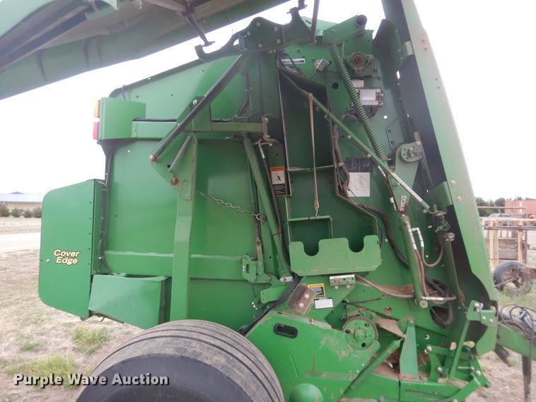 image for item IJ9308 2013 John Deere 569 Premium  round baler