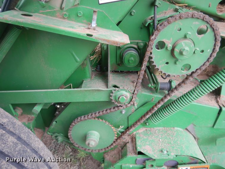 image for item IJ9308 2013 John Deere 569 Premium  round baler