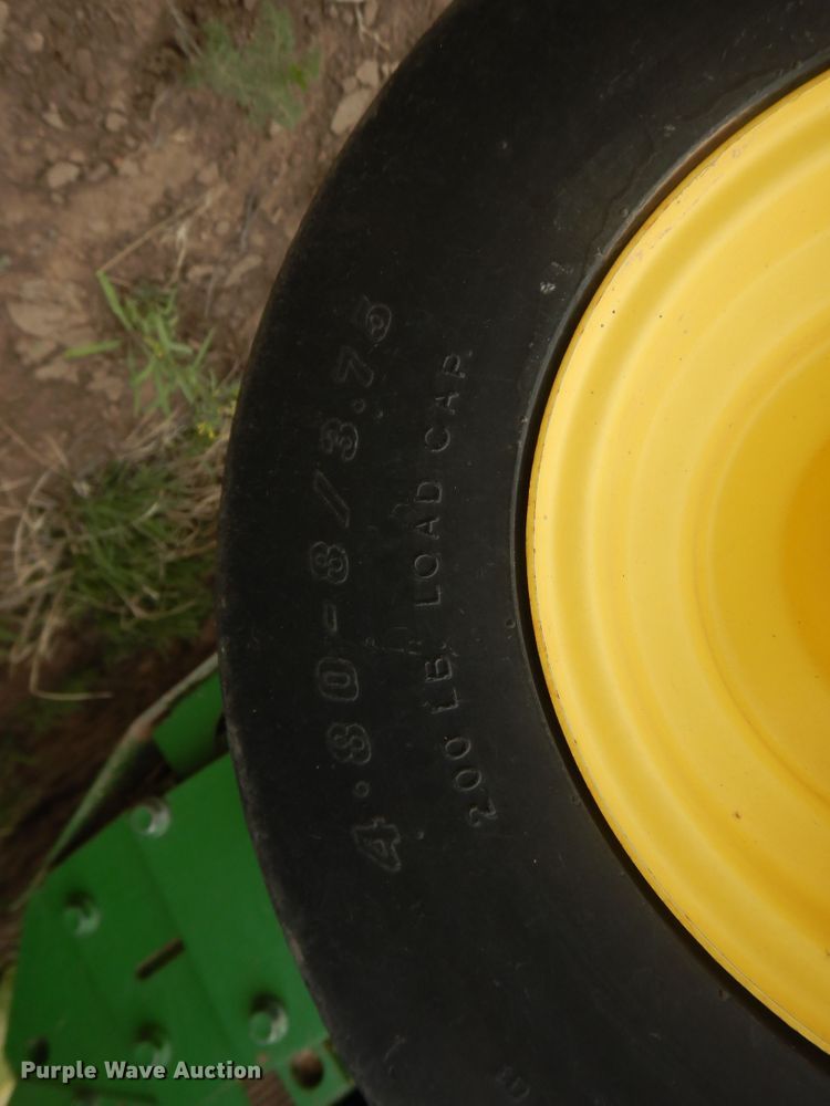 image for item IJ9308 2013 John Deere 569 Premium  round baler