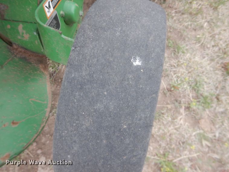 image for item IJ9308 2013 John Deere 569 Premium  round baler