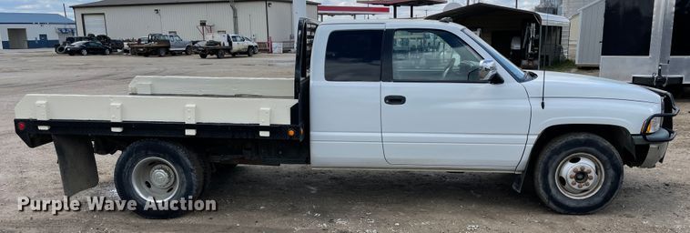 image for item IR9875 1997 Dodge Ram 3500  Club Cab flatbed pickup truck