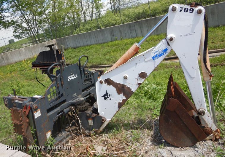 image for item IT9012 Bobcat 709FDS skid steer backhoe