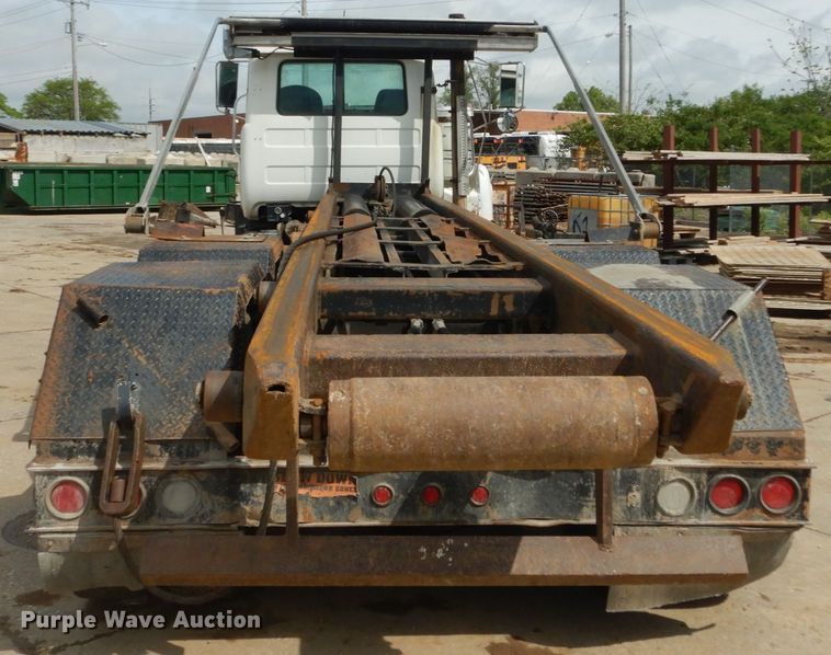 image for item IY9722 2004 Mack DM690S  roll-off container truck