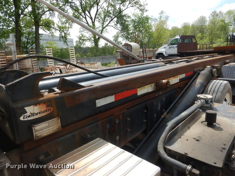 image for item IY9722 2004 Mack DM690S  roll-off container truck