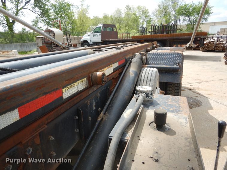 image for item IY9722 2004 Mack DM690S  roll-off container truck