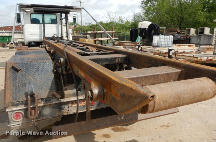 image for item IY9722 2004 Mack DM690S  roll-off container truck