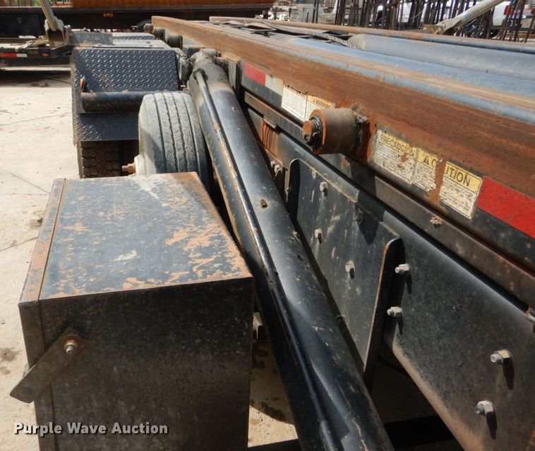 image for item IY9722 2004 Mack DM690S  roll-off container truck