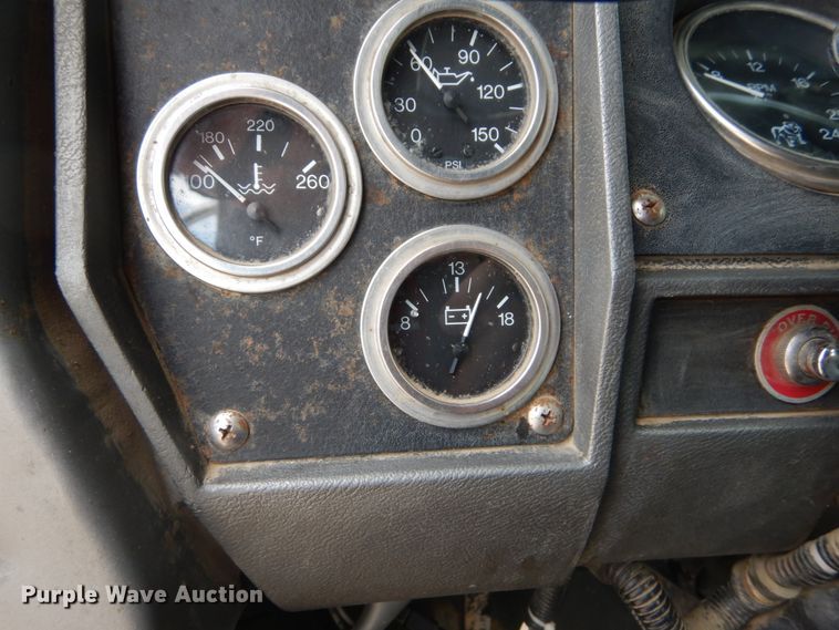 image for item IY9722 2004 Mack DM690S  roll-off container truck