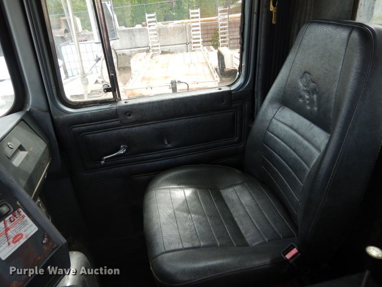 image for item IY9722 2004 Mack DM690S  roll-off container truck