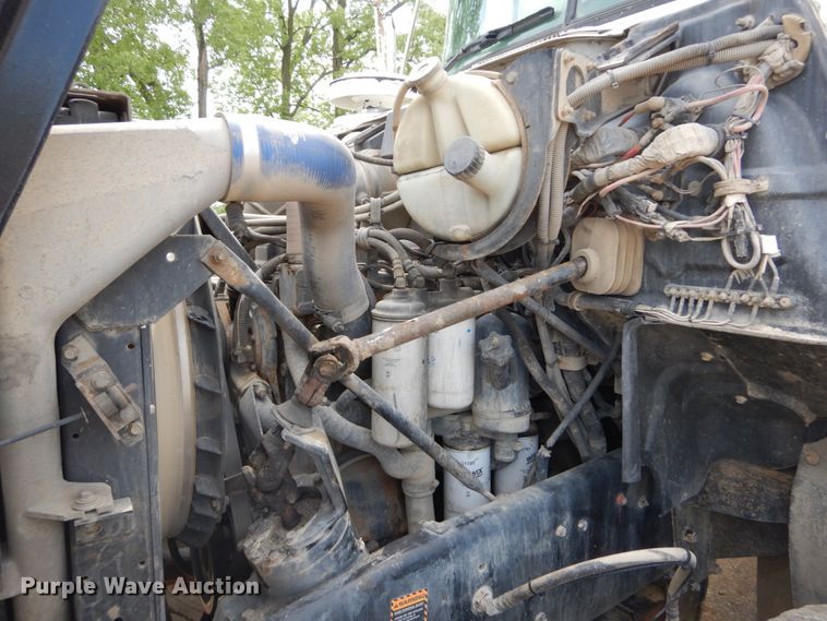 image for item IY9722 2004 Mack DM690S  roll-off container truck