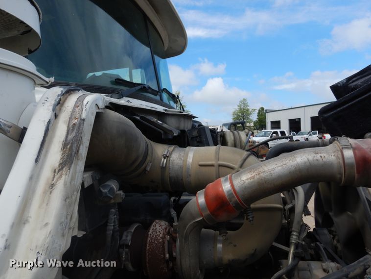 image for item IY9722 2004 Mack DM690S  roll-off container truck