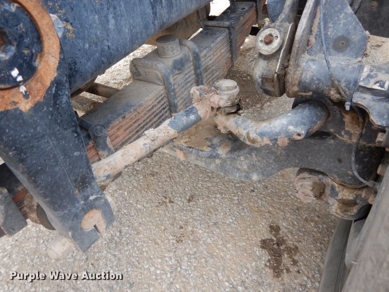 image for item IY9722 2004 Mack DM690S  roll-off container truck