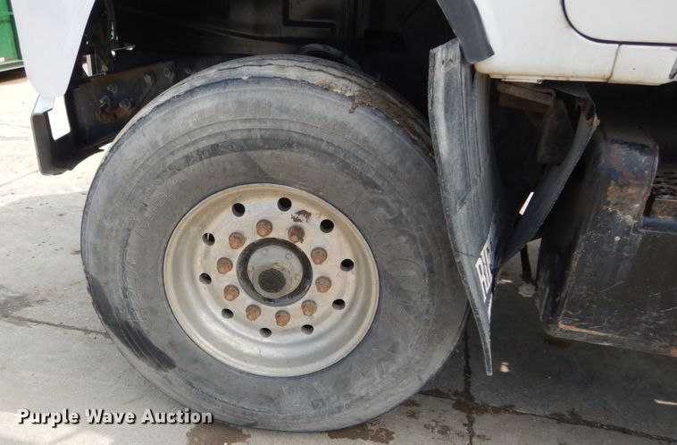 image for item IY9722 2004 Mack DM690S  roll-off container truck