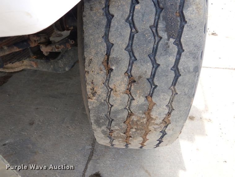 image for item IY9722 2004 Mack DM690S  roll-off container truck