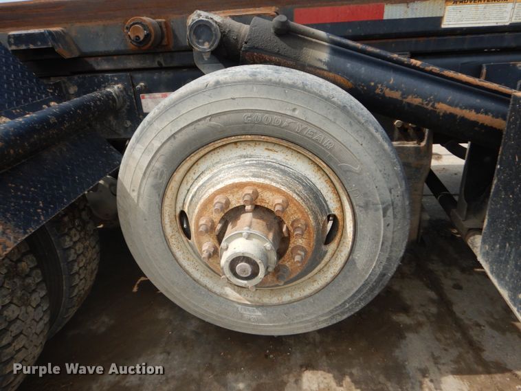 image for item IY9722 2004 Mack DM690S  roll-off container truck