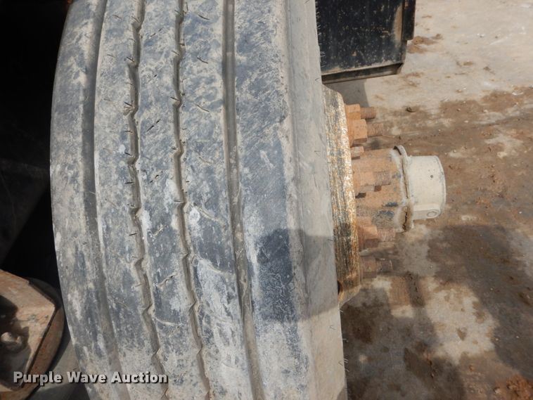 image for item IY9722 2004 Mack DM690S  roll-off container truck