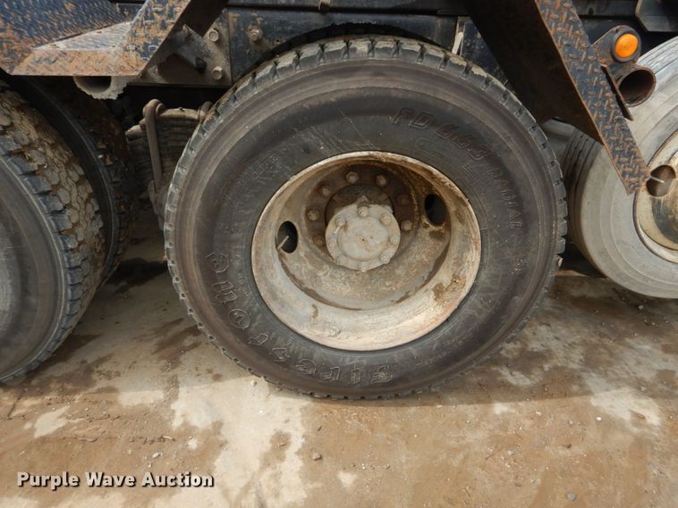 image for item IY9722 2004 Mack DM690S  roll-off container truck