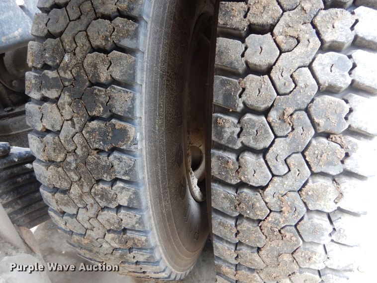 image for item IY9722 2004 Mack DM690S  roll-off container truck